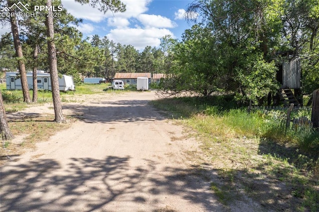 12185 Black Forest Rd, Colorado Springs, CO 80908 - view of dirt / gravel driveway