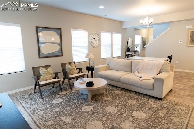 8176 Kittrick Pl, Peyton, CO 80831 - living room featuring a chandelier and wood finished floors