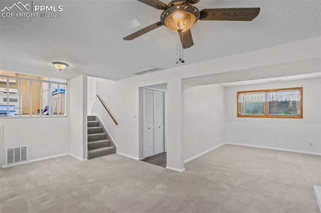 5888 Eldora Dr, Colorado Springs, CO 80918 - carpeted spare room featuring stairway, ceiling fan, and a textured ceiling
