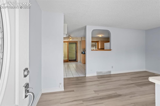 5888 Eldora Dr, Colorado Springs, CO 80918 - entrance foyer featuring a textured ceiling, wood finished floors, and a ceiling fan