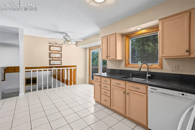 5888 Eldora Dr, Colorado Springs, CO 80918 - kitchen featuring white dishwasher, a textured ceiling, dark countertops, a ceiling fan, and light brown cabinets
