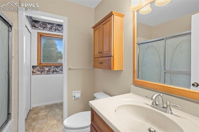 5888 Eldora Dr, Colorado Springs, CO 80918 - bathroom featuring vanity, an enclosed shower, and stone finish flooring