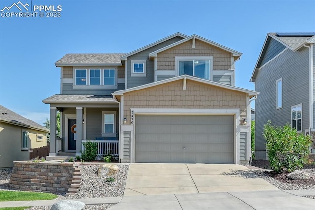 3470 Daydreamer Dr, Colorado Springs, CO 80908 - craftsman-style home with covered porch, driveway, an attached garage, and a shingled roof