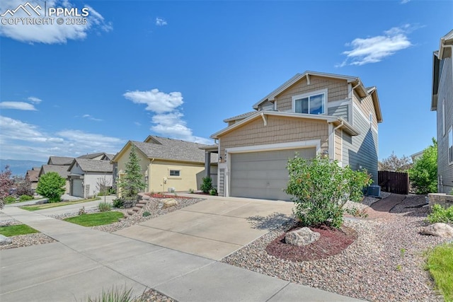 3470 Daydreamer Dr, Colorado Springs, CO 80908 - view of front of home featuring driveway, a garage, and a residential view