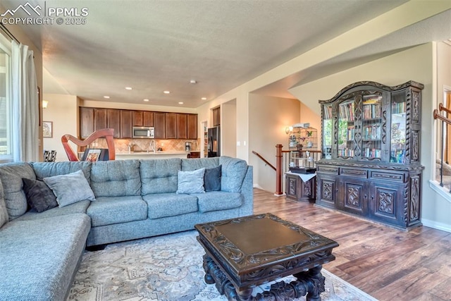 3470 Daydreamer Dr, Colorado Springs, CO 80908 - living room featuring wood finished floors and recessed lighting