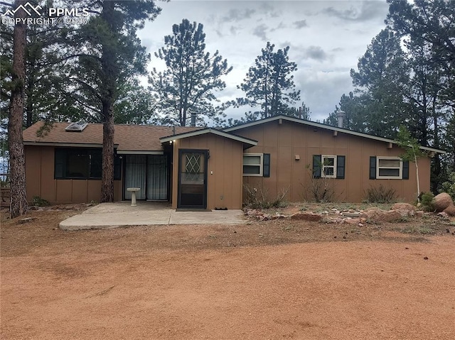 237 Blue Spruce Rd, Divide, CO 80814 - rear view of property featuring a patio area and board and batten siding