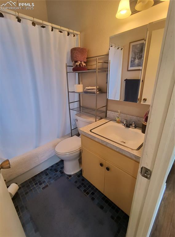 237 Blue Spruce Rd, Divide, CO 80814 - bathroom with vanity, tile patterned floors, and a shower with curtain