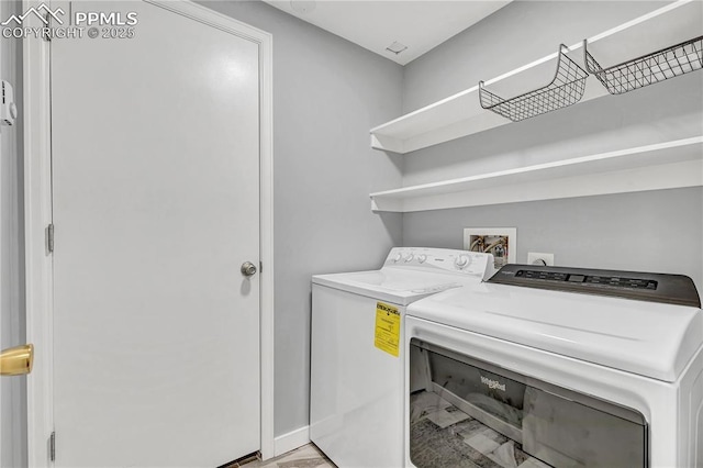 531 N Cedar St, Colorado Springs, CO 80903 - washroom with washer and dryer and baseboards