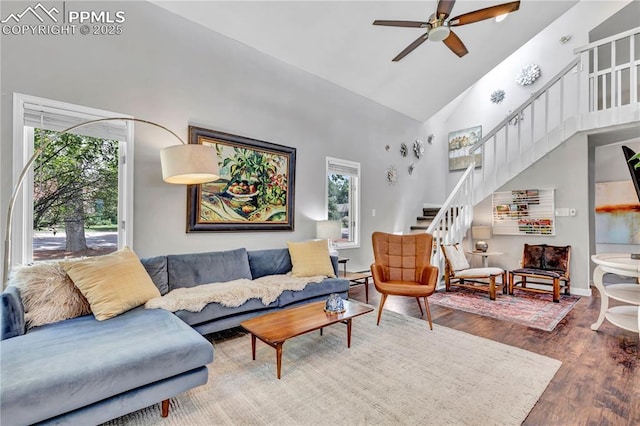 531 N Cedar St, Colorado Springs, CO 80903 - living room featuring high vaulted ceiling, stairway, a ceiling fan, and wood finished floors
