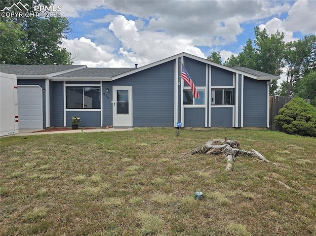 974 S Candlestar Loop, Fountain, CO 80817 - mid-century inspired home with a garage and a front lawn