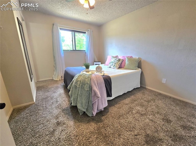 974 S Candlestar Loop, Fountain, CO 80817 - bedroom featuring a textured ceiling and carpet floors