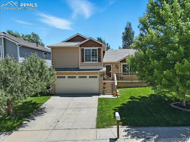 6275 Montarbor Dr, Colorado Springs, CO 80918 - split level home featuring brick siding, an attached garage, a front yard, concrete driveway, and roof with shingles
