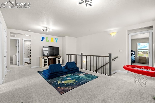 244 S Chipeta Way, Lochbuie, CO 80603 - living room with carpet flooring and a textured ceiling