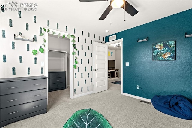 244 S Chipeta Way, Lochbuie, CO 80603 - bedroom with carpet, a walk in closet, a ceiling fan, and a closet