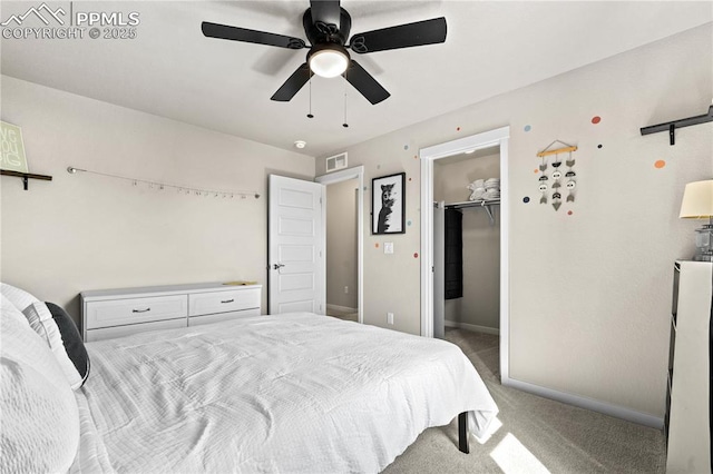 244 S Chipeta Way, Lochbuie, CO 80603 - bedroom with carpet floors, a walk in closet, and ceiling fan