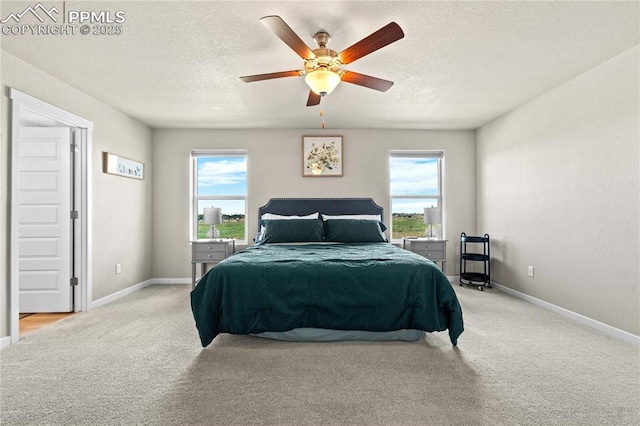244 S Chipeta Way, Lochbuie, CO 80603 - bedroom featuring light carpet, a textured ceiling, and ceiling fan