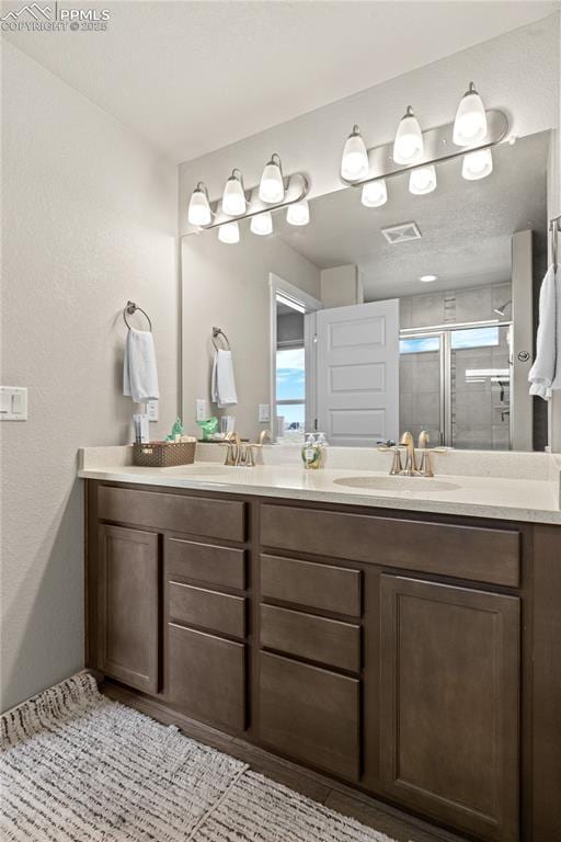 244 S Chipeta Way, Lochbuie, CO 80603 - full bath with double vanity and a shower stall