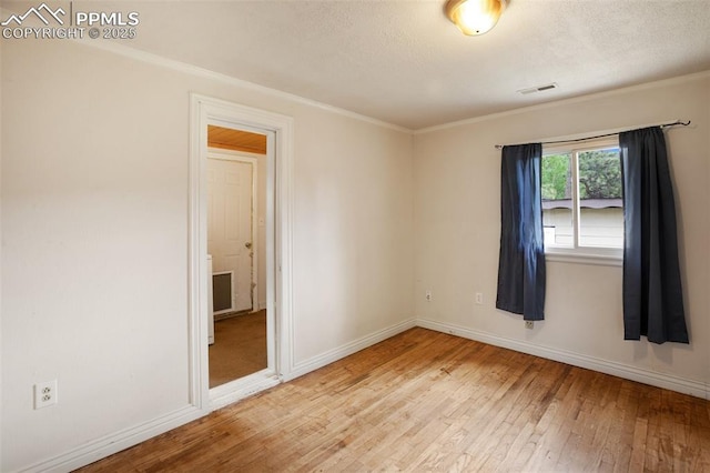 205 N Laurel St, Woodland Park, CO 80863 - unfurnished room with hardwood / wood-style flooring and ornamental molding