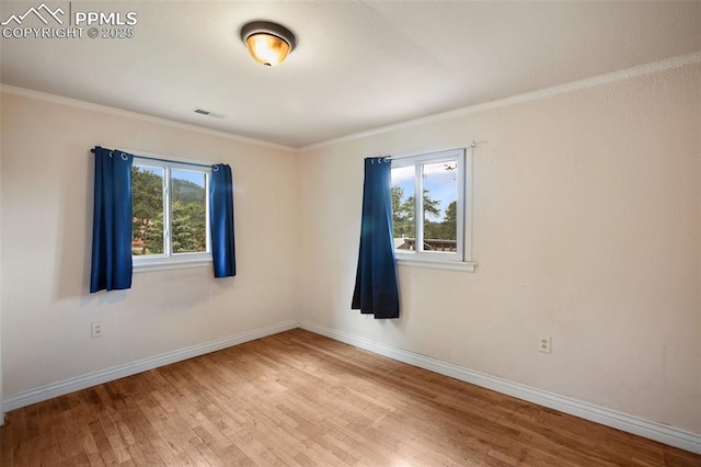 205 N Laurel St, Woodland Park, CO 80863 - spare room with wood finished floors and crown molding