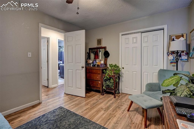 1222 Hartford St, Colorado Springs, CO 80906 - sitting room featuring light wood-type flooring, a textured ceiling, and ceiling fan
