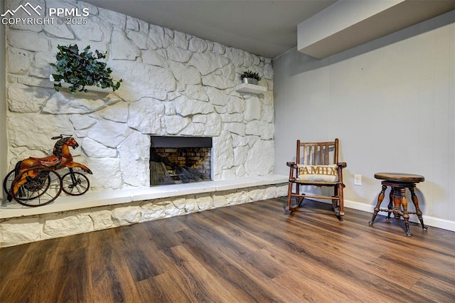 1222 Hartford St, Colorado Springs, CO 80906 - living area featuring wood finished floors and a stone fireplace