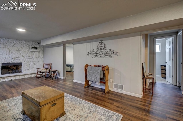 1222 Hartford St, Colorado Springs, CO 80906 - living area with wood finished floors and a stone fireplace