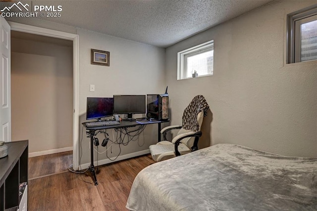 1222 Hartford St, Colorado Springs, CO 80906 - bedroom featuring wood finished floors and a textured ceiling