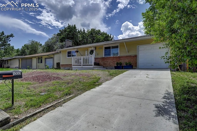 1222 Hartford St, Colorado Springs, CO 80906 - single story home featuring an attached garage, brick siding, a chimney, driveway, and a porch