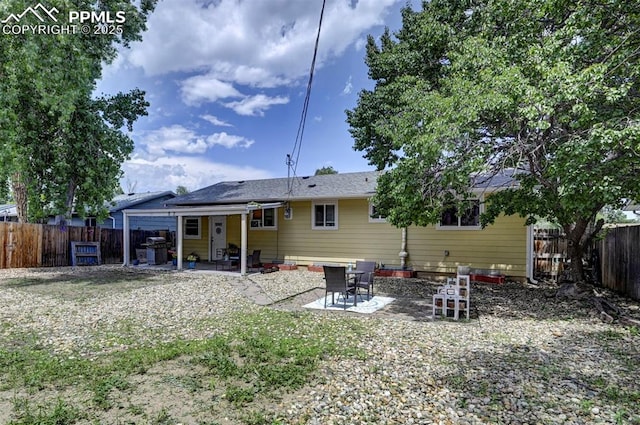 1222 Hartford St, Colorado Springs, CO 80906 - back of house with a patio and a fenced backyard