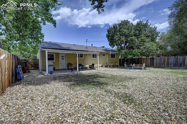 1222 Hartford St, Colorado Springs, CO 80906 - rear view of property with a patio and a fenced backyard