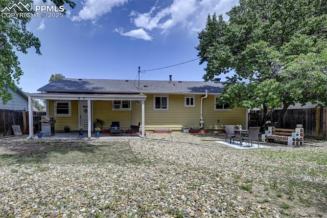 1222 Hartford St, Colorado Springs, CO 80906 - rear view of house with a patio and a fenced backyard