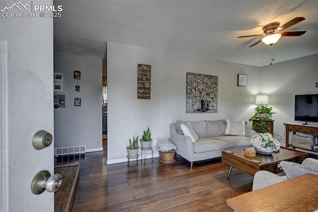 1222 Hartford St, Colorado Springs, CO 80906 - living area featuring ceiling fan, hardwood / wood-style floors, and a textured ceiling