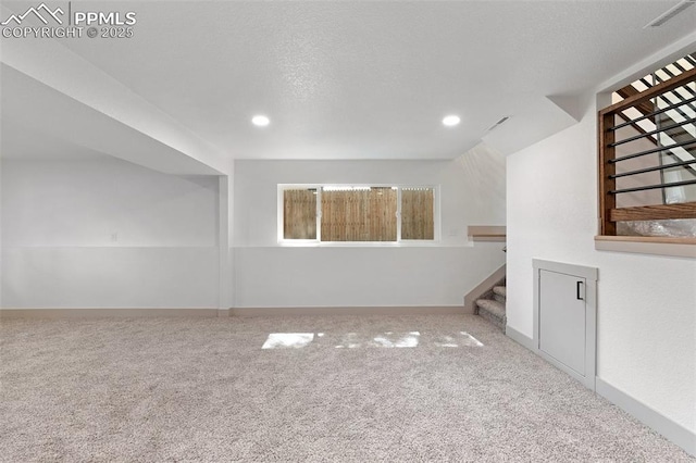 4615 Anjelina Cir, Colorado Springs, CO 80916 - unfurnished living room featuring stairway, carpet flooring, and recessed lighting