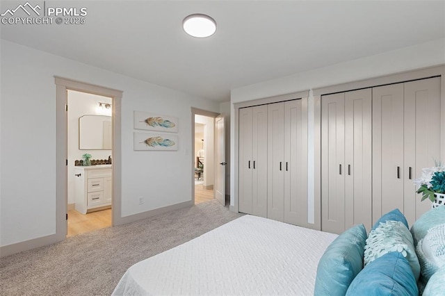 4615 Anjelina Cir, Colorado Springs, CO 80916 - bedroom featuring light carpet, two closets, and ensuite bath