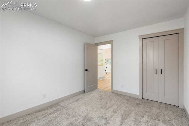 4615 Anjelina Cir, Colorado Springs, CO 80916 - unfurnished bedroom featuring carpet floors and a closet