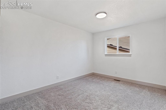 4615 Anjelina Cir, Colorado Springs, CO 80916 - carpeted empty room featuring baseboards