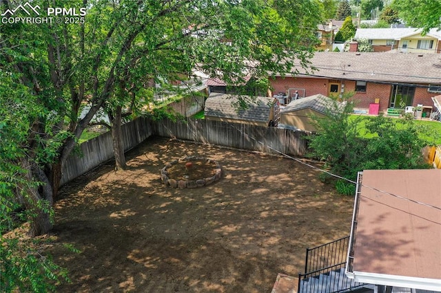 33 N Belmont St, Colorado Springs, CO 80911 - fenced backyard with a fire pit