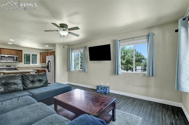 2601 Lynbarton Pt, Colorado Springs, CO 80918 - living area with ceiling fan, healthy amount of natural light, dark wood finished floors, and recessed lighting