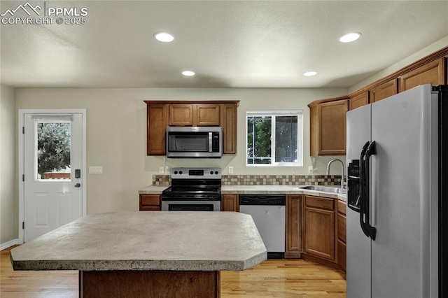 2601 Lynbarton Pt, Colorado Springs, CO 80918 - kitchen with appliances with stainless steel finishes, plenty of natural light, light wood finished floors, light countertops, and recessed lighting