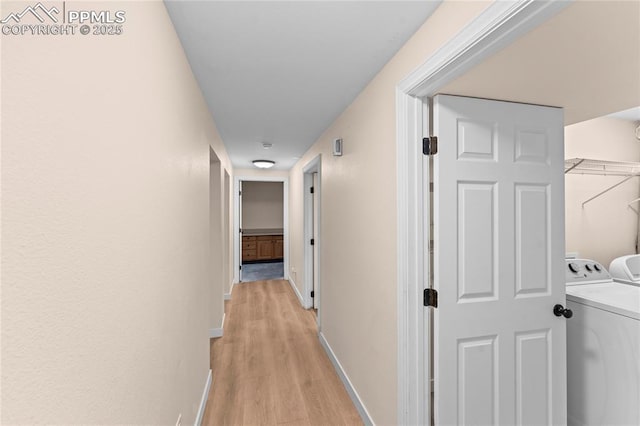 1005 Mountain View Rd, Woodland Park, CO 80863 - corridor with separate washer and dryer and light wood finished floors