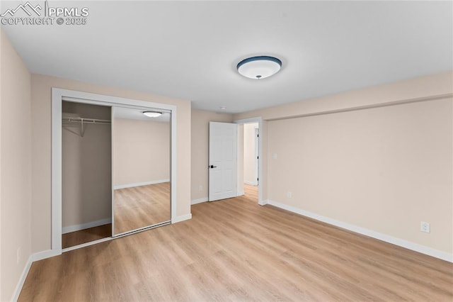 1005 Mountain View Rd, Woodland Park, CO 80863 - unfurnished bedroom with light wood-style floors and a closet