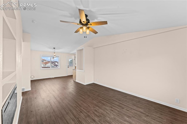 1005 Mountain View Rd, Woodland Park, CO 80863 - unfurnished living room featuring dark wood-style flooring, a ceiling fan, and lofted ceiling