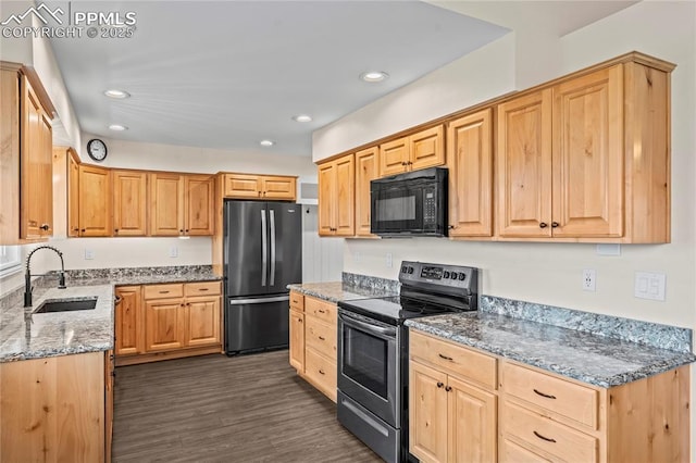 1005 Mountain View Rd, Woodland Park, CO 80863 - kitchen with black microwave, stainless steel electric range oven, freestanding refrigerator, stone counters, and light brown cabinetry