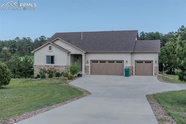 17529 Old Cherokee Trl, Colorado Springs, CO 80921 - view of front of home with an attached garage, stone siding, stucco siding, and a front lawn