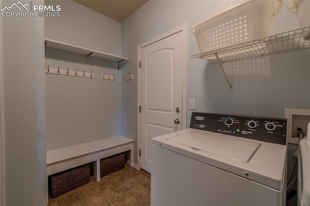 17529 Old Cherokee Trl, Colorado Springs, CO 80921 - laundry area with washer / dryer and tile patterned floors