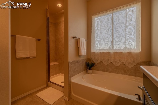 17529 Old Cherokee Trl, Colorado Springs, CO 80921 - full bathroom featuring a bath, tile patterned flooring, a tile shower, and vanity