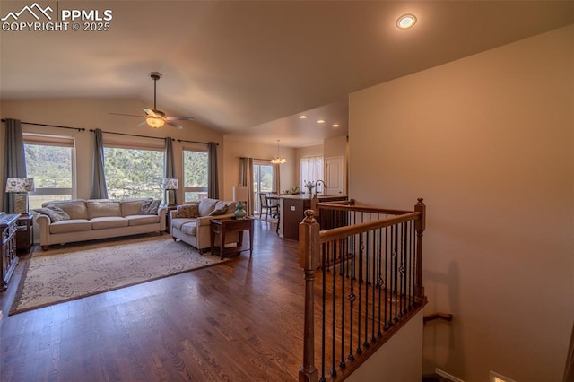 17529 Old Cherokee Trl, Colorado Springs, CO 80921 - living room featuring vaulted ceiling, a ceiling fan, dark wood finished floors, and recessed lighting