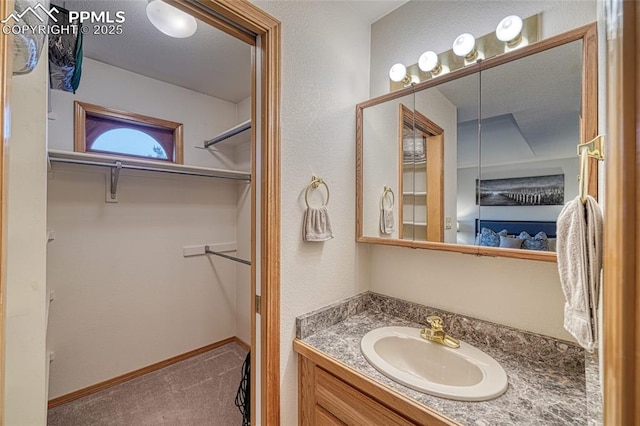 1520 Ledge Rock Ter, Colorado Springs, CO 80919 - bathroom with vanity and a spacious closet