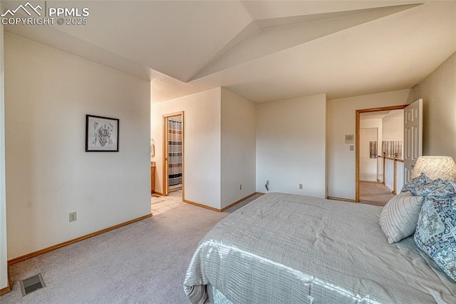1520 Ledge Rock Ter, Colorado Springs, CO 80919 - bedroom featuring light colored carpet and vaulted ceiling