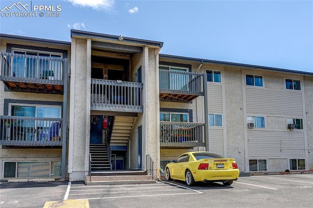 5034 El Camino Dr Unit 36, Colorado Springs, CO 80918 - view of property featuring uncovered parking and stairway